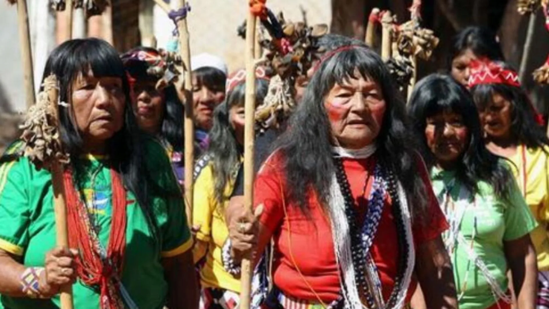 Guaraní community members in traditional dress