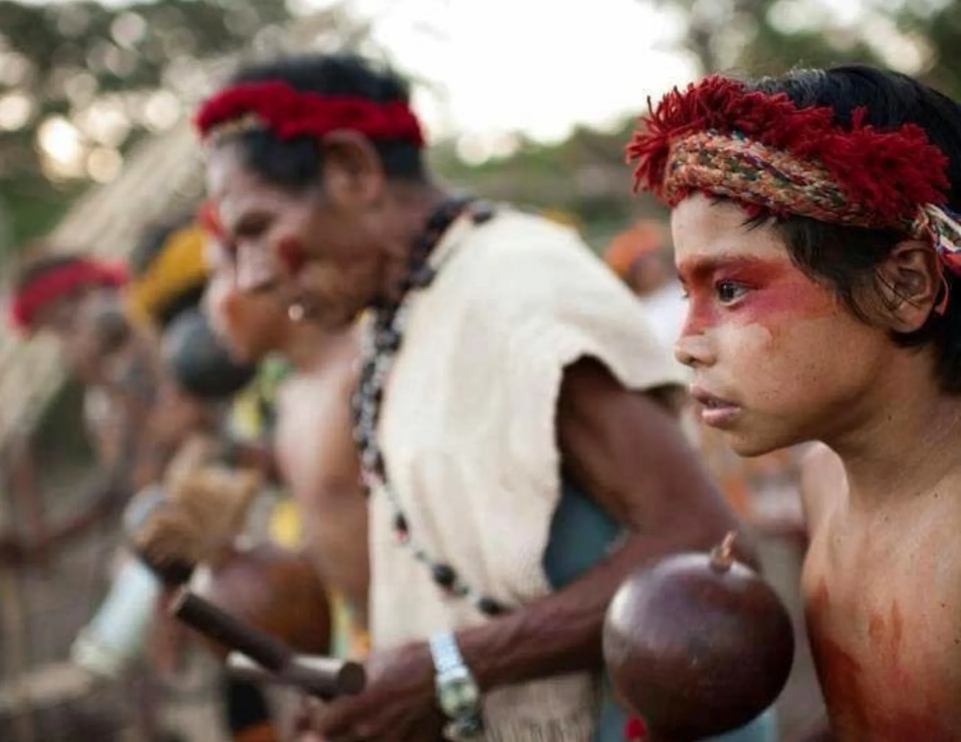 Guaraní elders and children in ceremonial attire